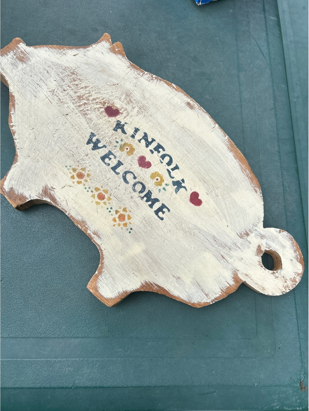 Wooden pig welcome sign